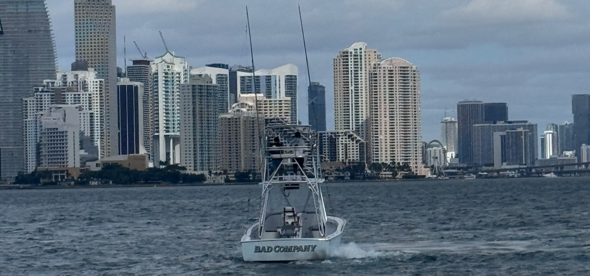 Two men displaying their catches on a sport fishing trip