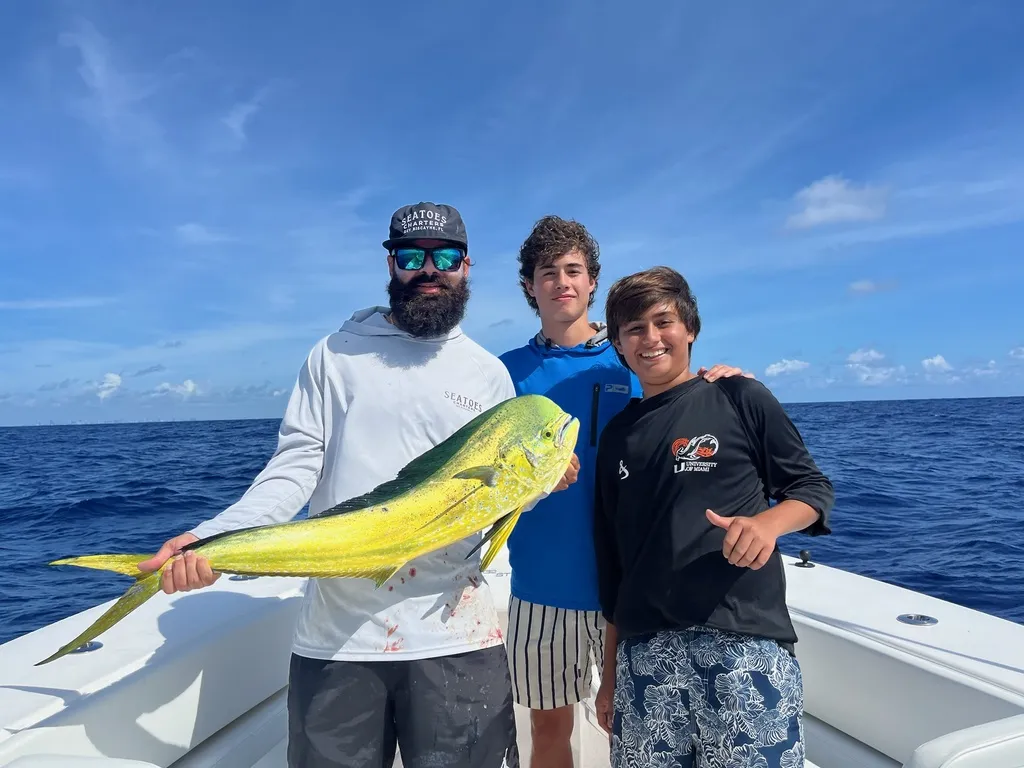 Family-friendly fishing charter in Key Biscayne with kids enjoying their catch