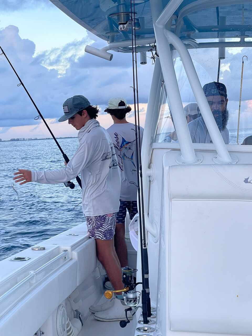 A group on a boat during a fishing trip in Coral Gables