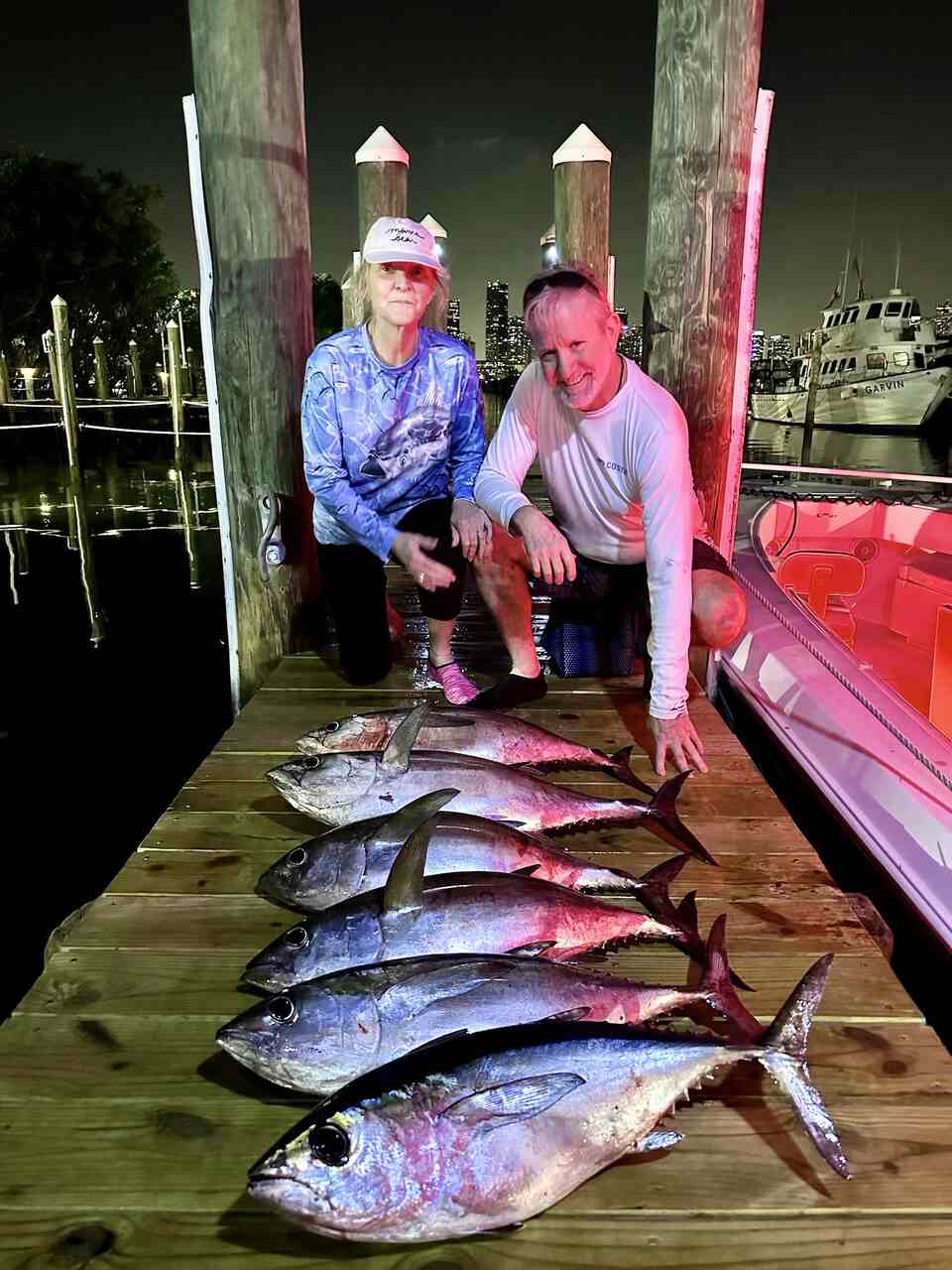 A couple posing with their catch in Coral Gables