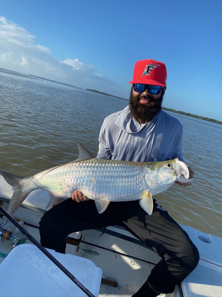 An angler showing their fish caught during a Coral Gables trip