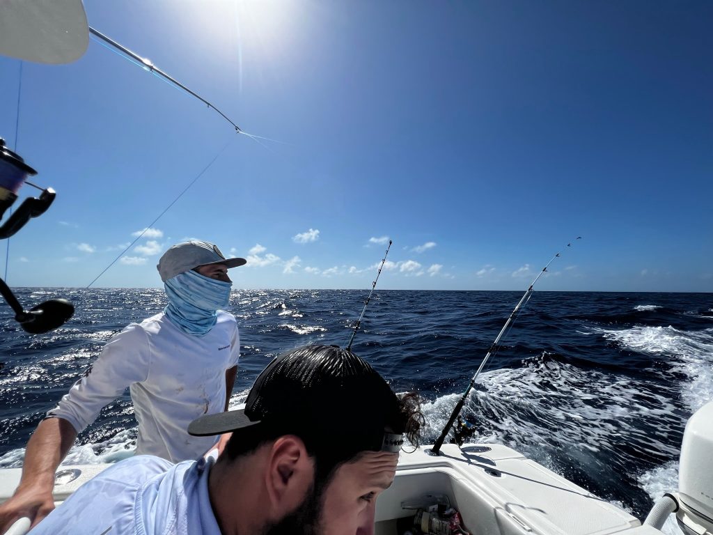 A group fishing on a boat in Brickell