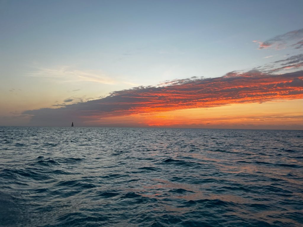 A sunset over the ocean seen during a fishing tour