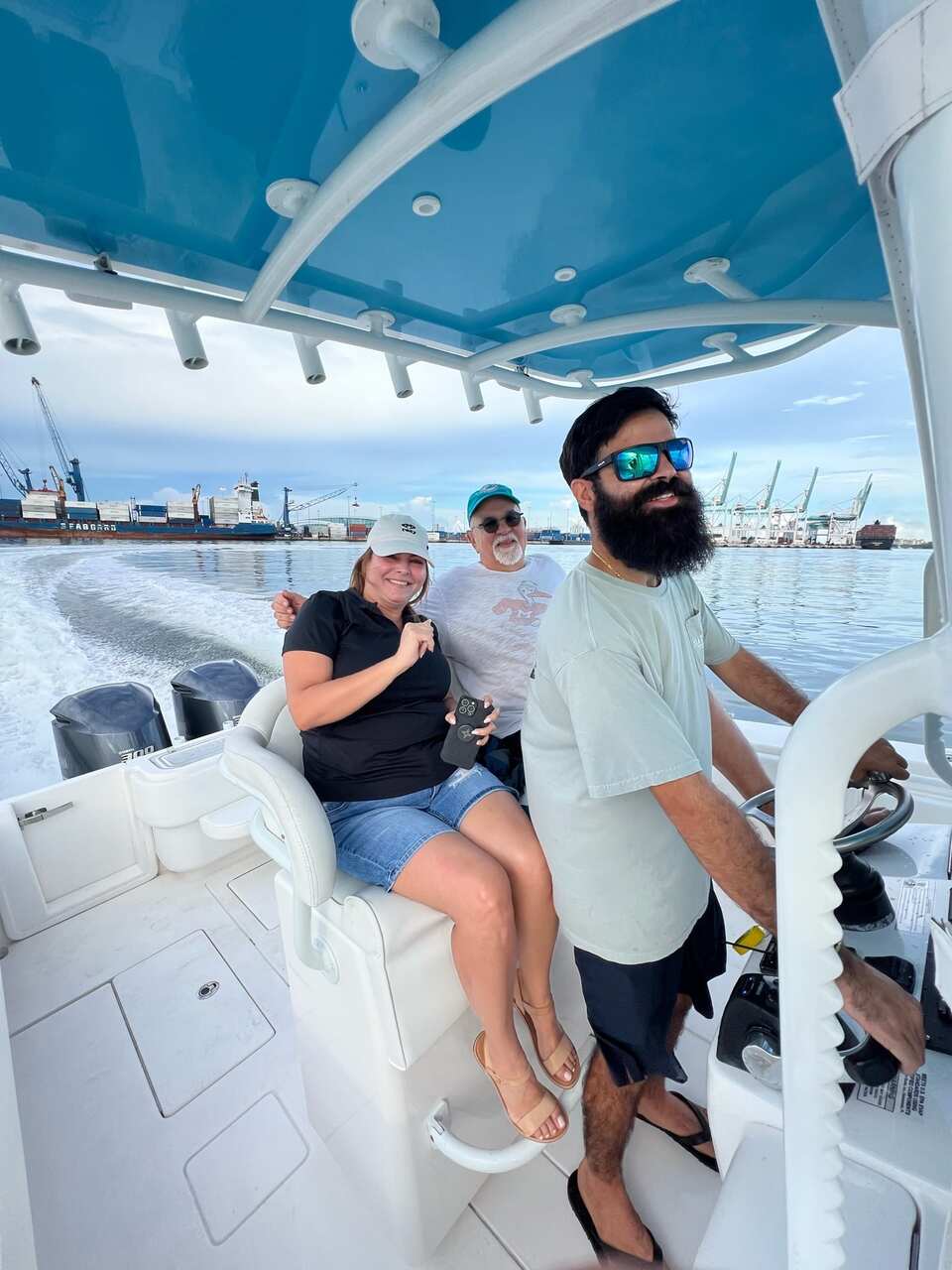 A group of people on a boat enjoying a fishing tour
