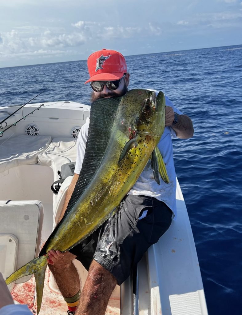 An angler displaying a fish caught in North Miami